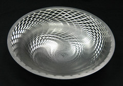 Stainless steel, with a custom hand finish.10-1/2" diameter x 2-1/2" high$150.00